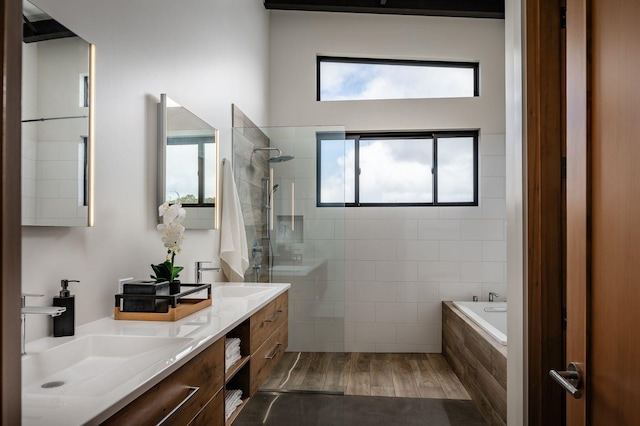 bathroom with vanity, wood-type flooring, and independent shower and bath