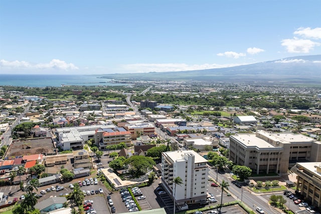 birds eye view of property with a water and mountain view