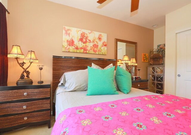 carpeted bedroom with ceiling fan