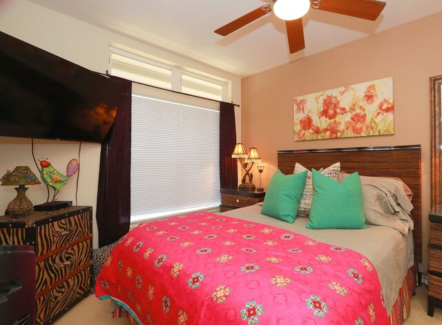 carpeted bedroom featuring ceiling fan