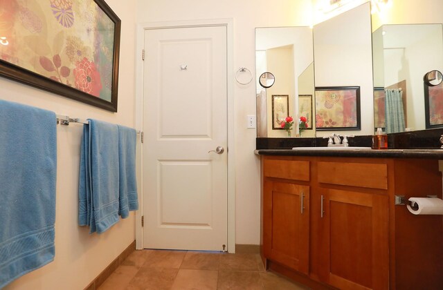 bathroom with tile patterned flooring and vanity