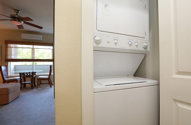 laundry area featuring carpet flooring, ceiling fan, and stacked washing maching and dryer