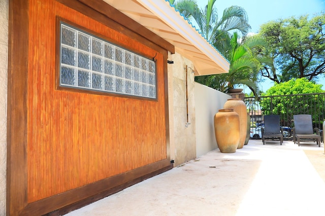 view of side of property with a patio area