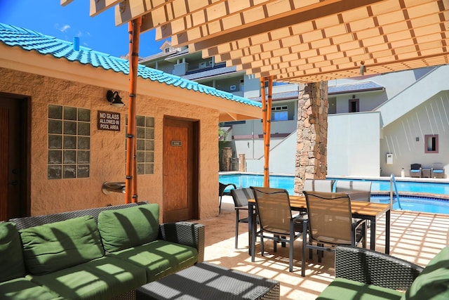 view of patio with an outdoor hangout area and a community pool