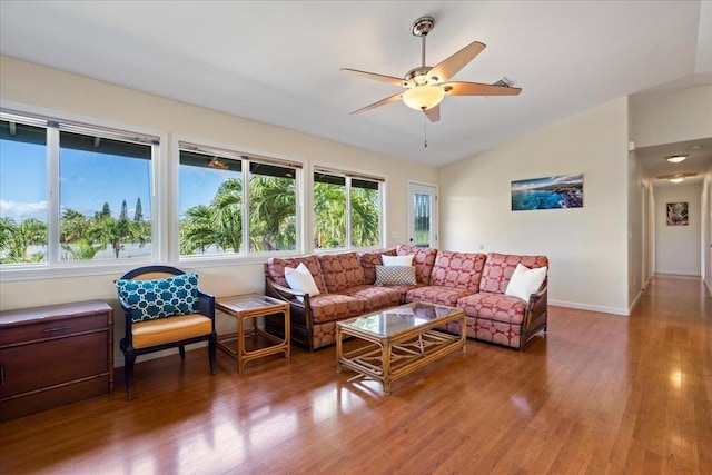 living room featuring ceiling fan, lofted ceiling, and hardwood / wood-style floors