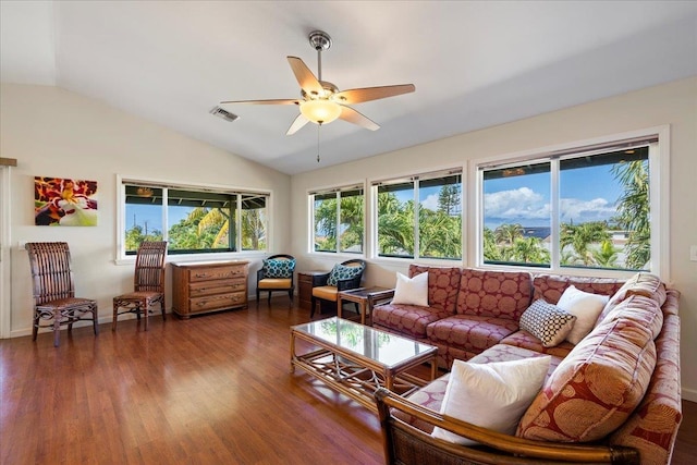 living room with dark wood-type flooring, ceiling fan, and vaulted ceiling