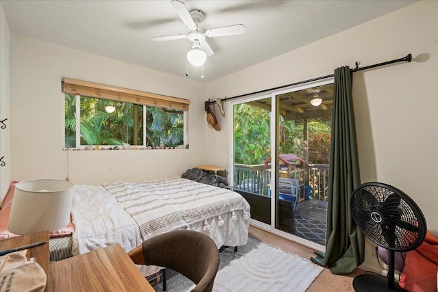 bedroom featuring access to exterior, carpet floors, and ceiling fan