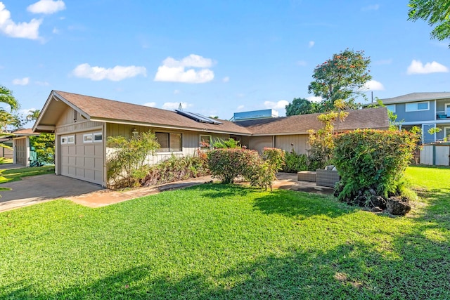 ranch-style home featuring outdoor lounge area, a front yard, roof mounted solar panels, a garage, and driveway