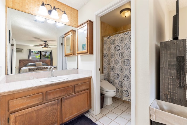 full bath with connected bathroom, toilet, vanity, visible vents, and tile patterned floors