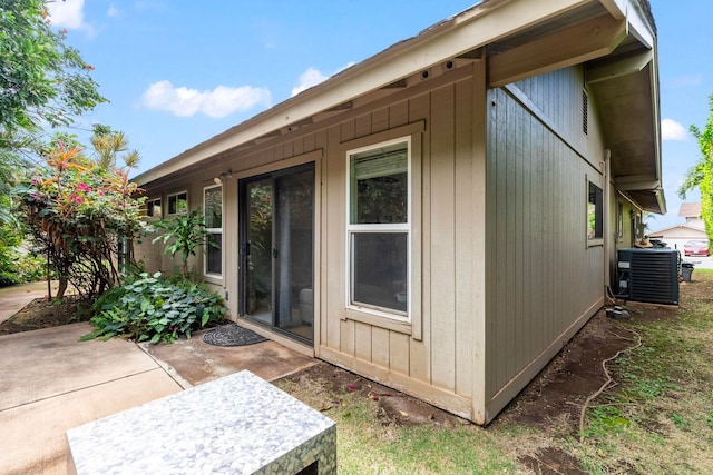 view of property exterior featuring central AC and a patio area