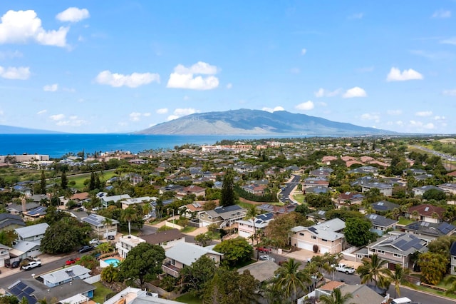 bird's eye view with a residential view and a water and mountain view