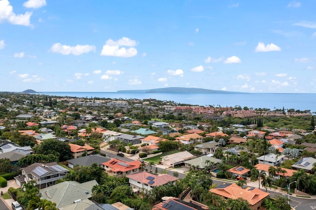 drone / aerial view with a water view and a residential view