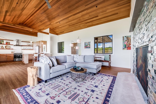 living room with a stone fireplace, hardwood / wood-style floors, vaulted ceiling, and wooden ceiling