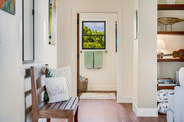 doorway to outside with wood-type flooring