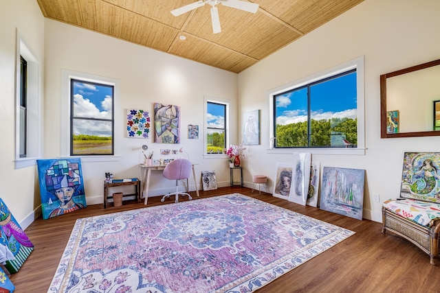 interior space featuring ceiling fan, wooden ceiling, and a healthy amount of sunlight