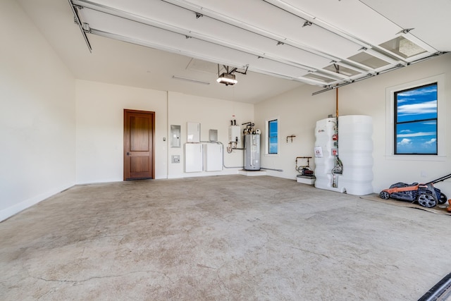 garage featuring electric panel, a garage door opener, fridge, separate washer and dryer, and water heater