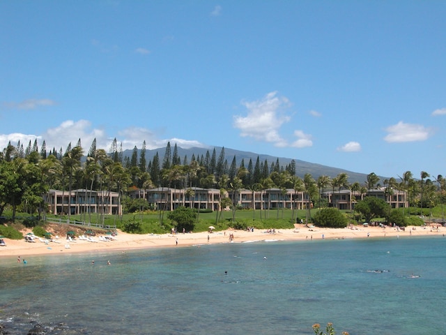 property view of water featuring a mountain view and a view of the beach