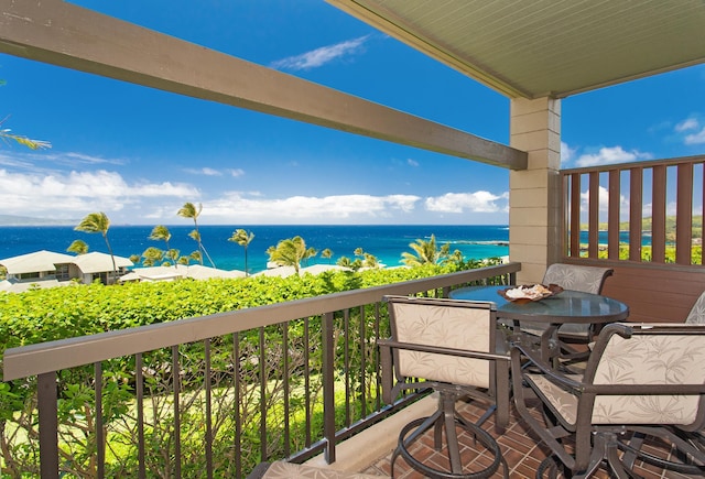 balcony featuring a water view