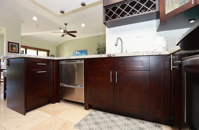 kitchen with tasteful backsplash, light stone counters, ornamental molding, ceiling fan, and light tile patterned floors