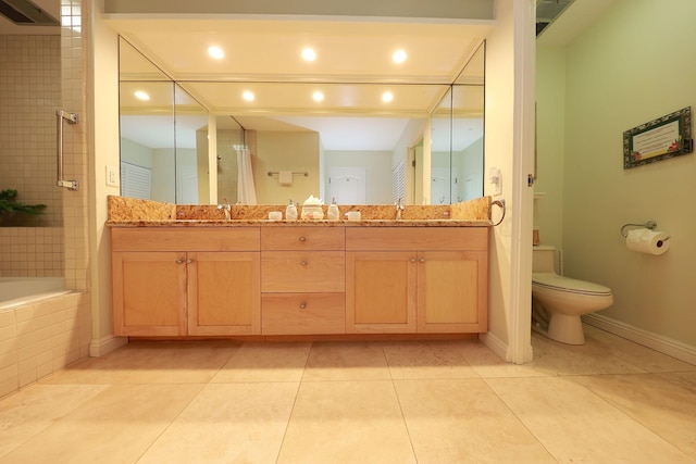 bathroom featuring tile patterned flooring, vanity, and toilet