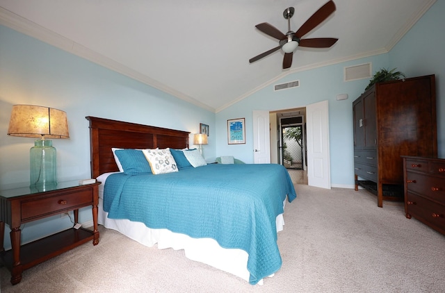 bedroom featuring ceiling fan, light colored carpet, vaulted ceiling, and ornamental molding