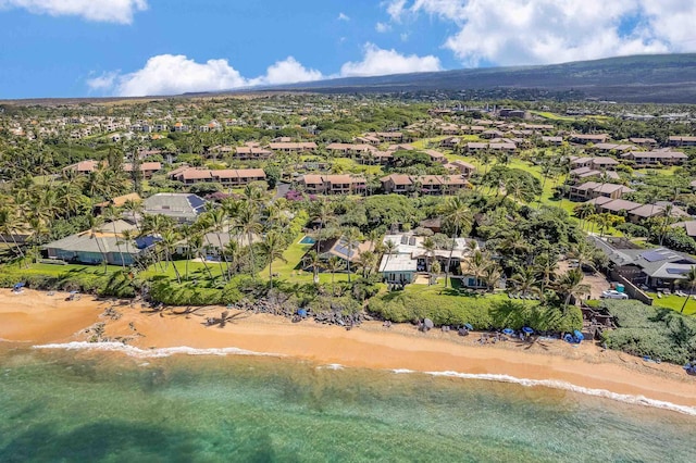 aerial view with a water view and a view of the beach