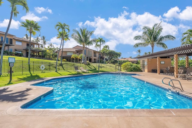 view of swimming pool featuring a yard and a patio