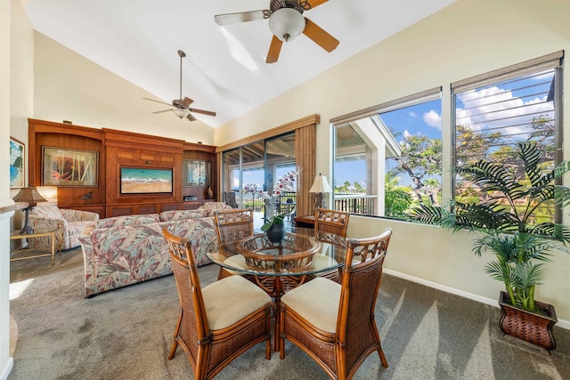 dining room with ceiling fan, carpet, and lofted ceiling