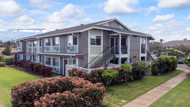 view of front of house with a front lawn