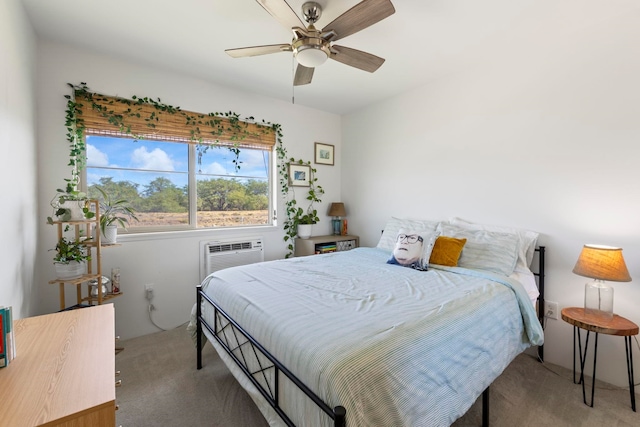 carpeted bedroom featuring an AC wall unit and ceiling fan