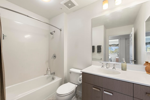 full bathroom featuring vanity, toilet, and washtub / shower combination