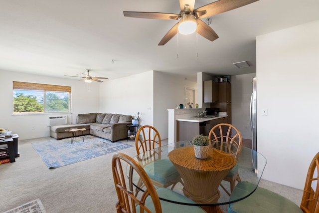 carpeted dining room featuring ceiling fan and sink