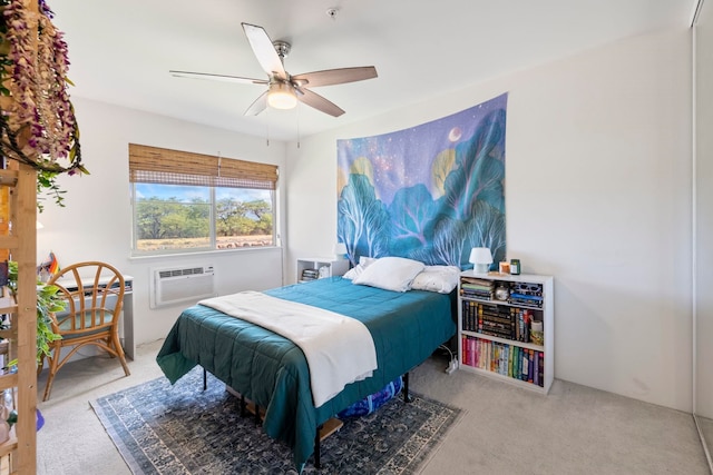 carpeted bedroom with a wall mounted AC and ceiling fan