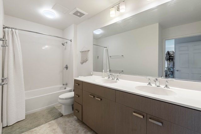 full bathroom with vanity, shower / bath combo with shower curtain, and toilet