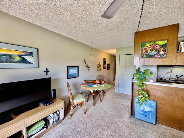 carpeted dining area featuring lofted ceiling and a textured ceiling