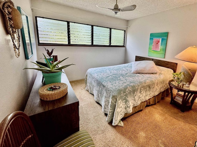 carpeted bedroom featuring a textured ceiling