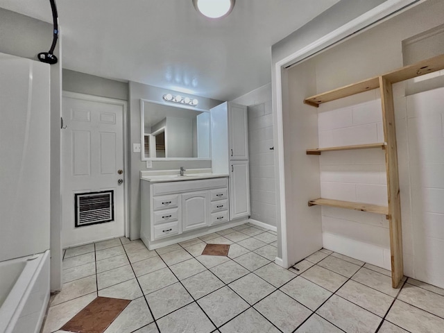 bathroom featuring tile patterned flooring and vanity