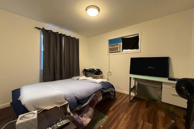 bedroom with dark hardwood / wood-style flooring and cooling unit