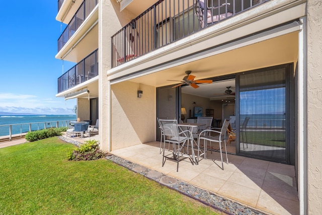 4401 Lower Honoapiilani Rd Unit A-103, Lahaina, HI 96761 - view of patio featuring a balcony, a water view, and a ceiling fan