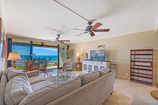 tiled living room with ceiling fan and ornamental molding