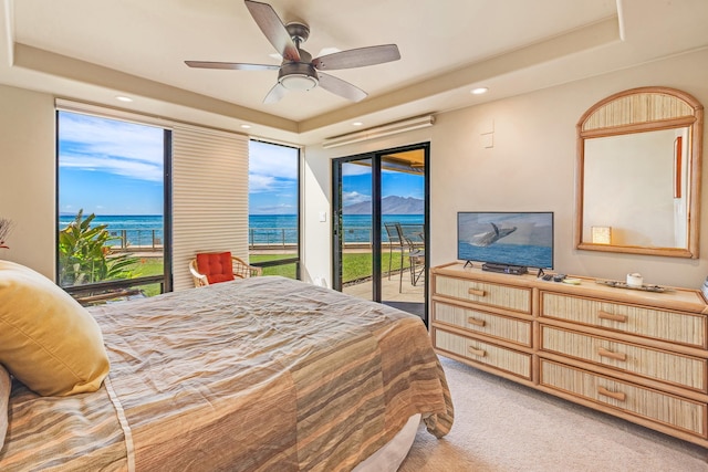 4401 Lower Honoapiilani Rd Unit A-103, Lahaina, HI 96761 - bedroom with a raised ceiling, access to outside, light colored carpet, recessed lighting, and ceiling fan