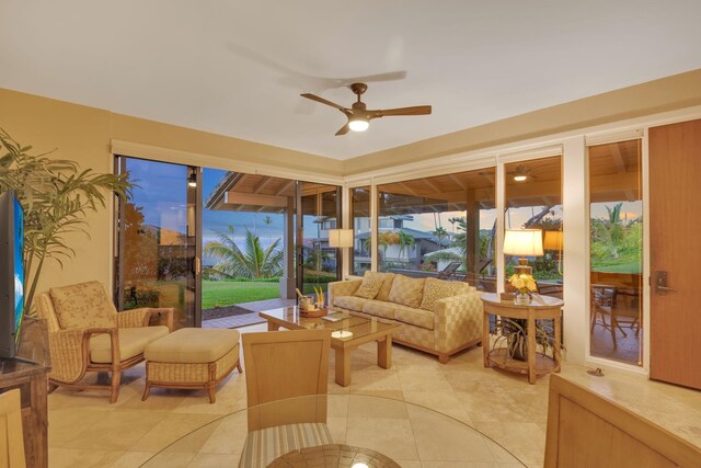 sunroom / solarium with a ceiling fan