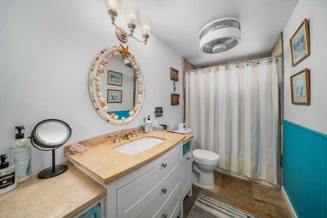 bathroom with a shower with curtain, vanity, and toilet