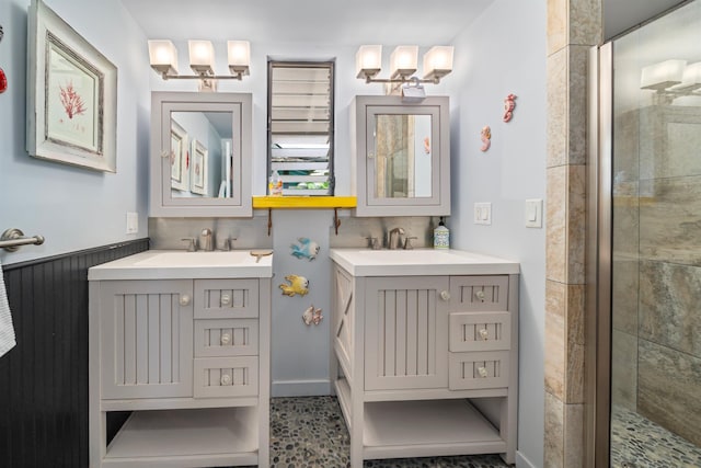 bathroom with tile patterned floors, a shower with door, and vanity