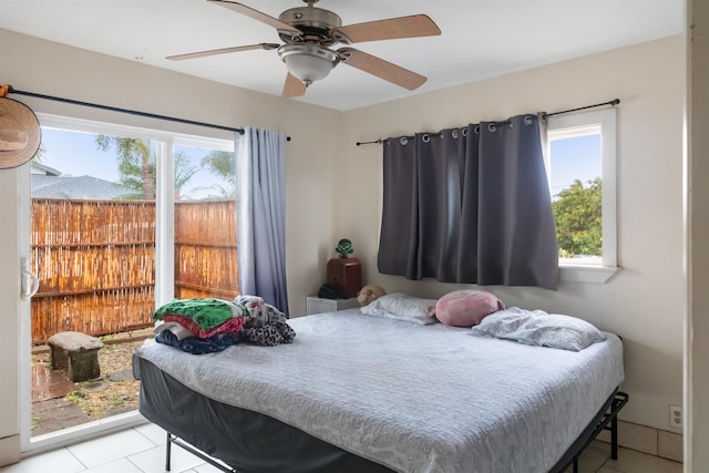 bedroom with ceiling fan and light tile patterned floors