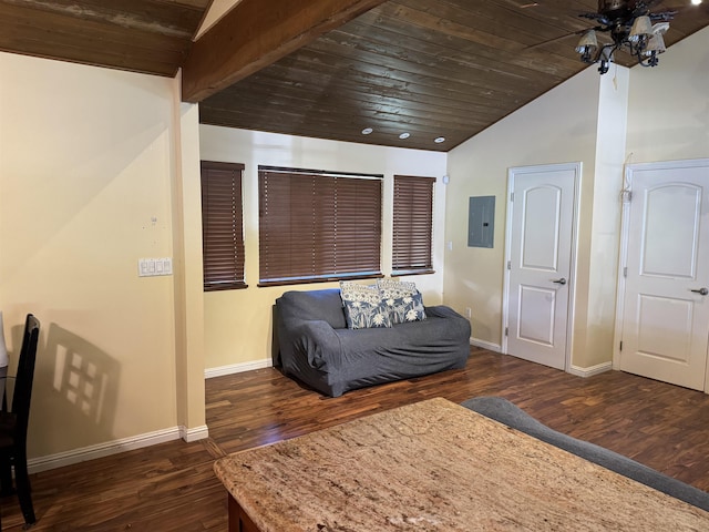 living area featuring baseboards, electric panel, wood finished floors, and vaulted ceiling