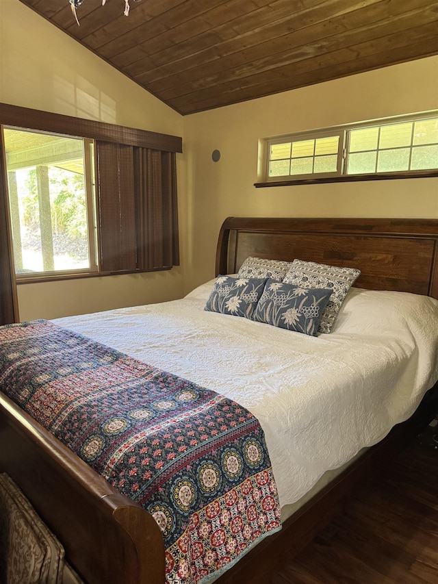 bedroom featuring vaulted ceiling and wooden ceiling