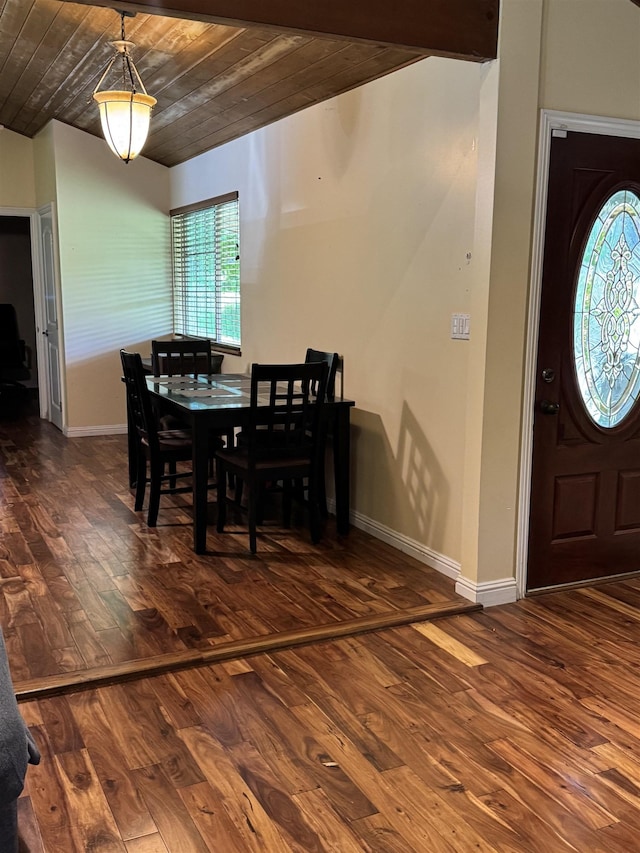 dining space with baseboards, a healthy amount of sunlight, and wood finished floors