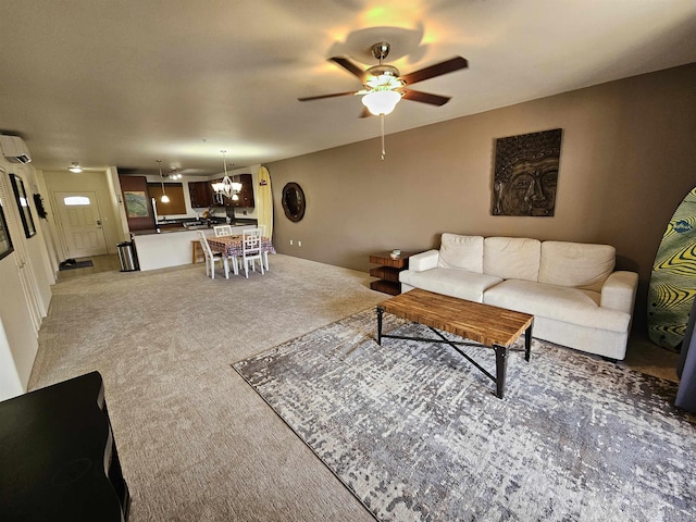 carpeted living room with ceiling fan with notable chandelier and an AC wall unit