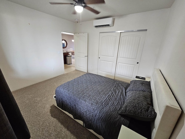 bedroom featuring ceiling fan, light colored carpet, an AC wall unit, and a closet